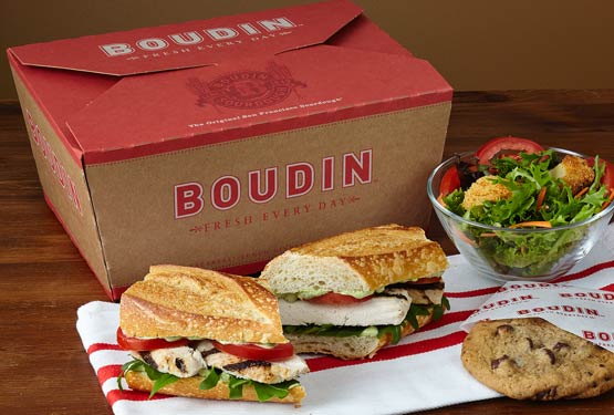 Boudin Catering lunch box with a sandwich, salad and cookie